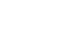広い階段と自然石張りのエントランスが重厚感を醸すファサード。透かし彫りのブロックや植栽の軽やかに揺れる樹影が、美しいコントラストを描きます。駐車場からのアプローチはスロープにすることで、ベビーカーの方に配慮しました。 